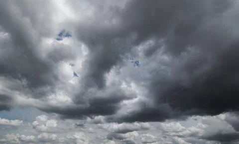 Dark storm clouds with background,Dark clouds before a thunder-storm. Stock Photos