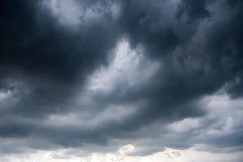 Dark storm clouds with background,Dark clouds before a thunder-storm. Stock Photos