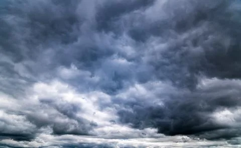 Dark storm clouds with background,Dark clouds before a thunder-storm. Stockfoto's