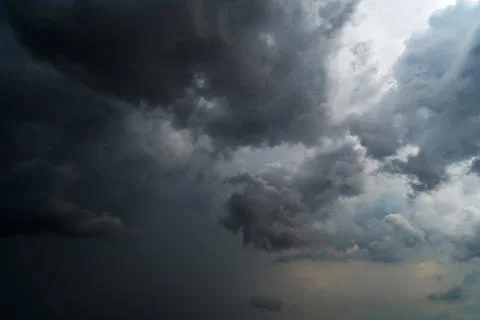 Dark storm clouds with background,Dark clouds before a thunder-storm. Stock Photos