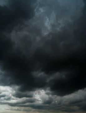 Dark storm clouds with background,Dark clouds before a thunder-storm. Stock Photos