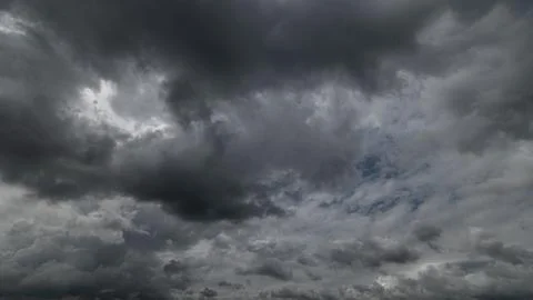 Dark storm clouds with background,Dark clouds before a thunder-storm. Stock Photos