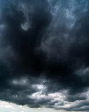 Dark storm clouds with background,Dark clouds before a thunder-storm. Stock Photos
