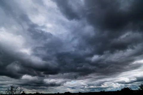 Dark storm clouds with background,Dark clouds before a thunder-storm. Stock Photos