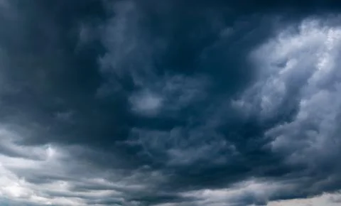 Dark storm clouds with background,Dark clouds before a thunder-storm. Stockfoto's