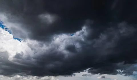 Dark storm clouds with background,Dark clouds before a thunder-storm. Stock Photos