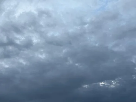 Dark Storm Clouds with Bright Opening Near Horizon Stock Photos