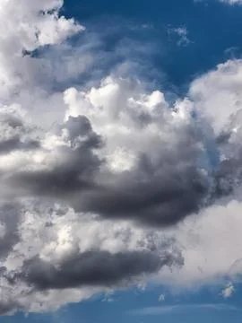 Dark Storm Clouds Building Beneath Bright White Cumulus Stock Photos