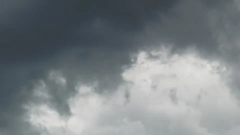Dark storm clouds covering bright sky patch in windy motion. Stock Footage 337048239