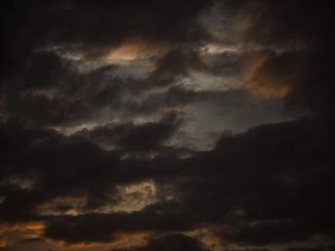 Dark Storm Clouds with Dramatic Light and Texture Stock Photos