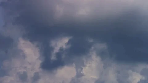 Dark storm clouds fill the sky moving very slowly Video stock 329757815