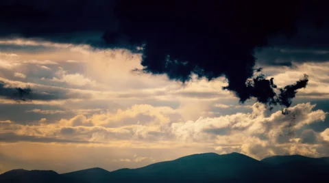 Dark storm clouds form at sunset.Mountain aerial. Stock Footage 49980502