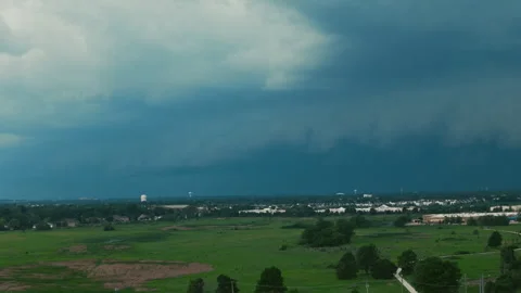 Dark storm clouds forming over the countryside before severe weather. Dramatic 스톡 동영상 344029551
