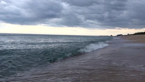 Dark storm clouds gather above rough sea before rain. Dramatic coastline Stock Footage 337777132