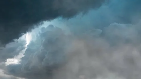 Dark storm clouds gather in dramatic sky motion. Stock Footage 341388905