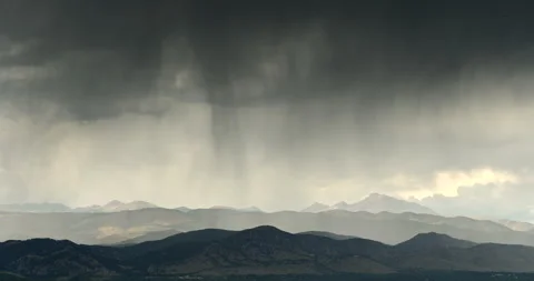 Dark storm clouds gather over the Rocky Mountains in Colorado, USA Stock Footage 266952478