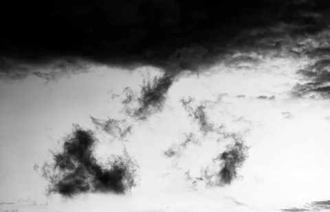 Dark storm clouds gather in the sky, creating a dramatic and moody atmosphere Stock Photos