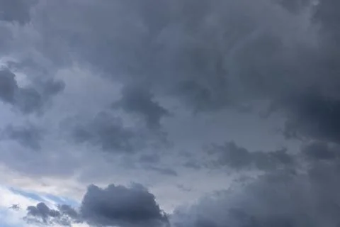 Dark storm clouds gathering creating a dramatic sky 写真素材