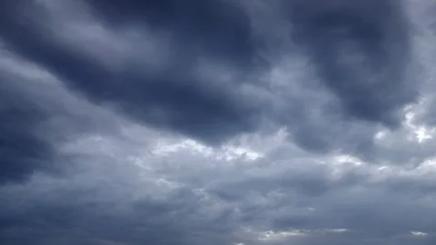 Dark Storm Clouds Gathering Over Open Landscape as Heavy Rain Begins 스톡 동영상 341912118