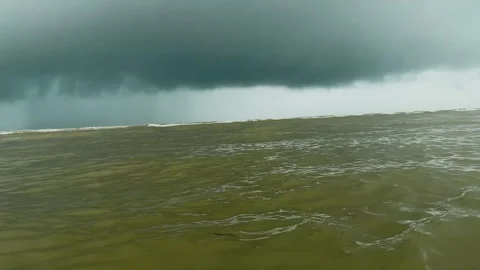 Dark storm clouds gathering over the turbulent ocean waves Stock Footage 344986369