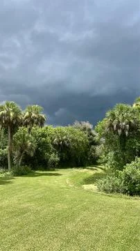 Dark Storm Clouds Gathering Over Tropical Florida Landscape Stock Photos