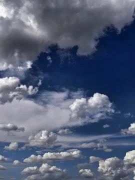Dark Storm Clouds Gathering Over Deep Blue Summer Sky Stock Photos
