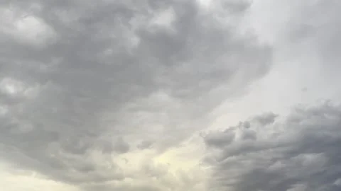 Dark Storm Clouds With Golden Light Near Horizon Видео 344883646