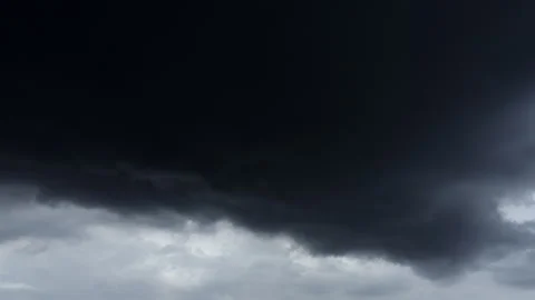 Dark storm clouds merge rapidly as severe weather develops overhead. Stock Footage 339784169