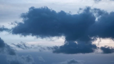 Dark storm clouds move across sky as sky darkens. Time lapse Stock Footage 105925417