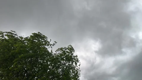 Dark storm clouds moving quickly on a windy day Stock Footage 337054395