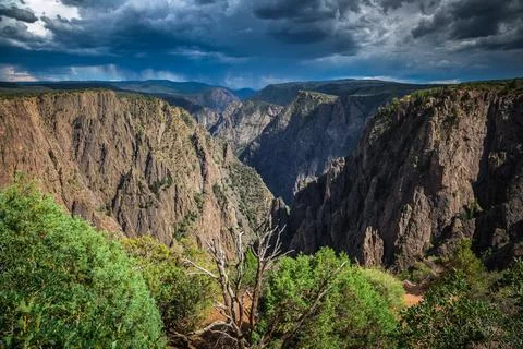Dark Storm Clouds over the Black Canyon, Black Canyon of the Gunnison National Stock Photos
