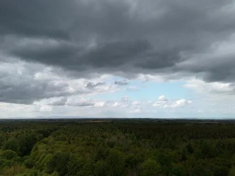 Dark Storm Clouds Over Forest Landscape Stock Photos