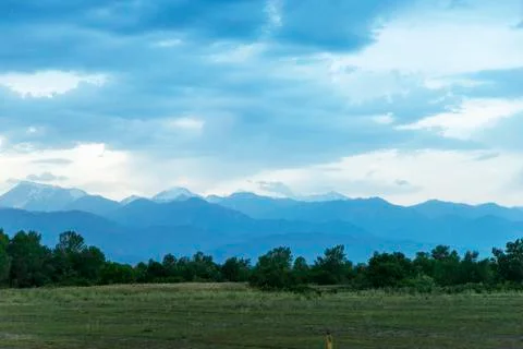 Dark storm clouds over the green hills of the Caucasus mountains in Azerbaija Stock Photos