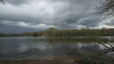 Dark Storm Clouds over Lake Timelapse Video stock 239086499