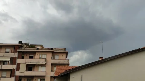 Dark Storm Clouds Over Residential Buildings in Pistoia, Italy Stock Footage 345173647