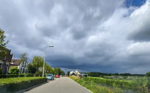 Dark storm clouds over the ring canal of the Zuidplaspolder Stock Photos