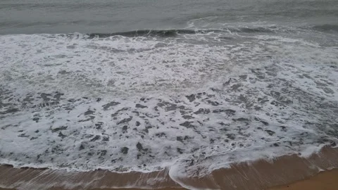 Dark storm clouds over rough sea waves on coastline Stock Footage 323258120
