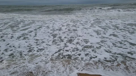 Dark storm clouds over rough sea waves on coastline Stock Footage 323258226