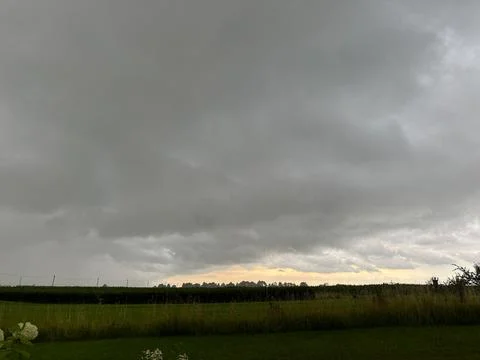Dark Storm Clouds Over Rural Fields Before Heavy Summer Rain Stock Photos