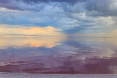 Dark storm clouds over a salt lake before a rain Stock Photos