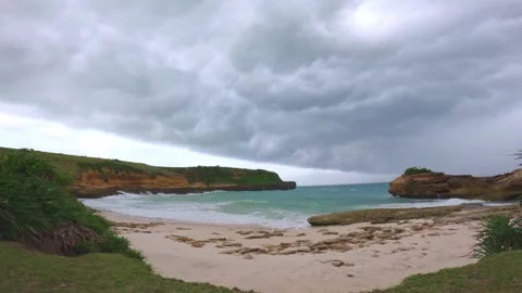 Dark Storm Clouds over Sandy Beach Cove, South Lombok, Indonesia Stock Footage 341819185