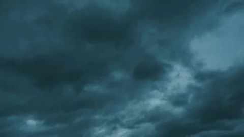 Dark storm clouds quickly move towards Stock Footage 76179382
