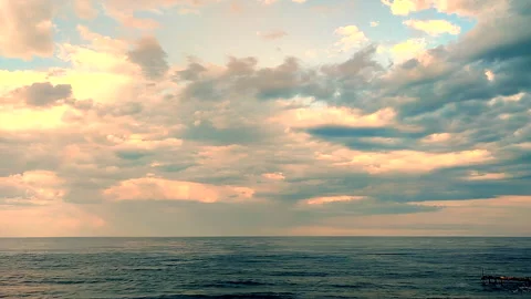 Dark storm clouds, rain and sea surface at sunset. Nature. Natural background Stock Footage 284719227