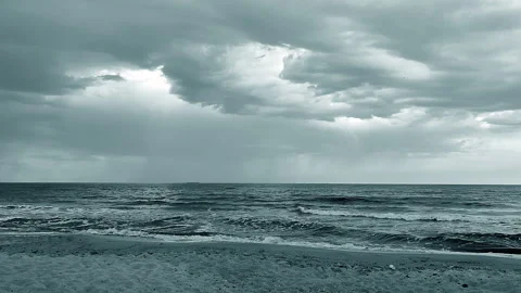 Dark storm clouds, rain and sea surface at sunset. Nature. Natural background Stock Footage 285370717