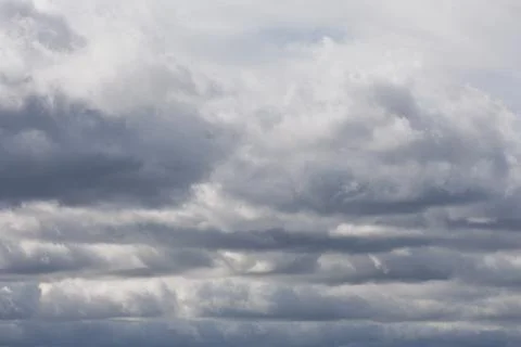 Dark storm clouds before the rain. Bad weather. Stock Photos