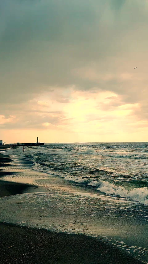 Dark storm clouds rain sea surface at sunset Nature Natural background Vertical Stock Footage 288623148