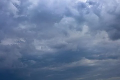 Dark storm clouds before rain. Sky frowned. Stock Photos
