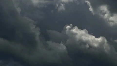 Dark storm clouds reveal a silver lining as they move past in this time lapse vi 스톡 동영상 201884038