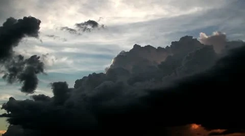 Dark, storm clouds roll in with an ominous, impending feel. Stock Footage