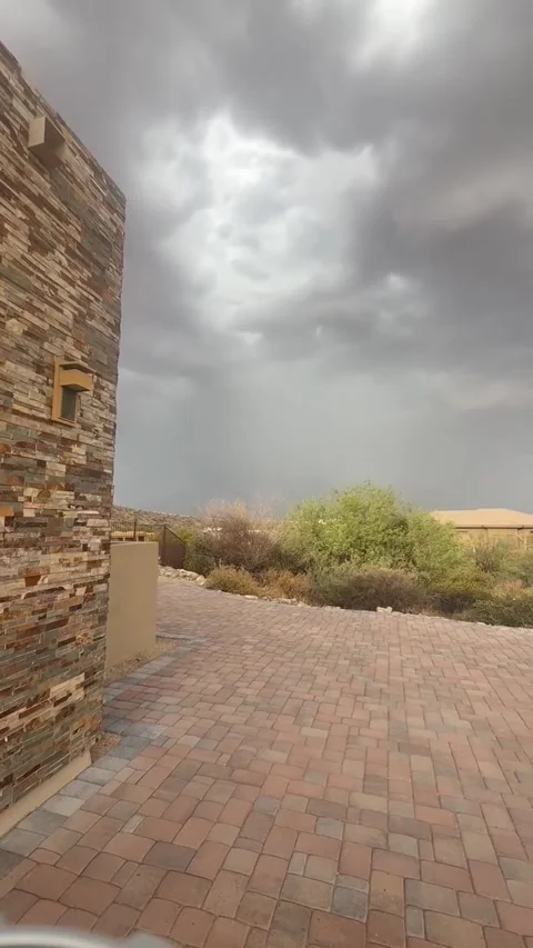 Dark Storm Clouds Rolling Over Desert Courtyard Stock-Footage 339775987